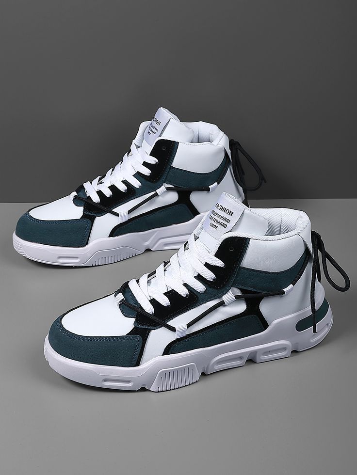 Alt Text: Pair of high-top sneakers in white, black, and teal with thick white soles and white laces, displayed on a gray studio background.