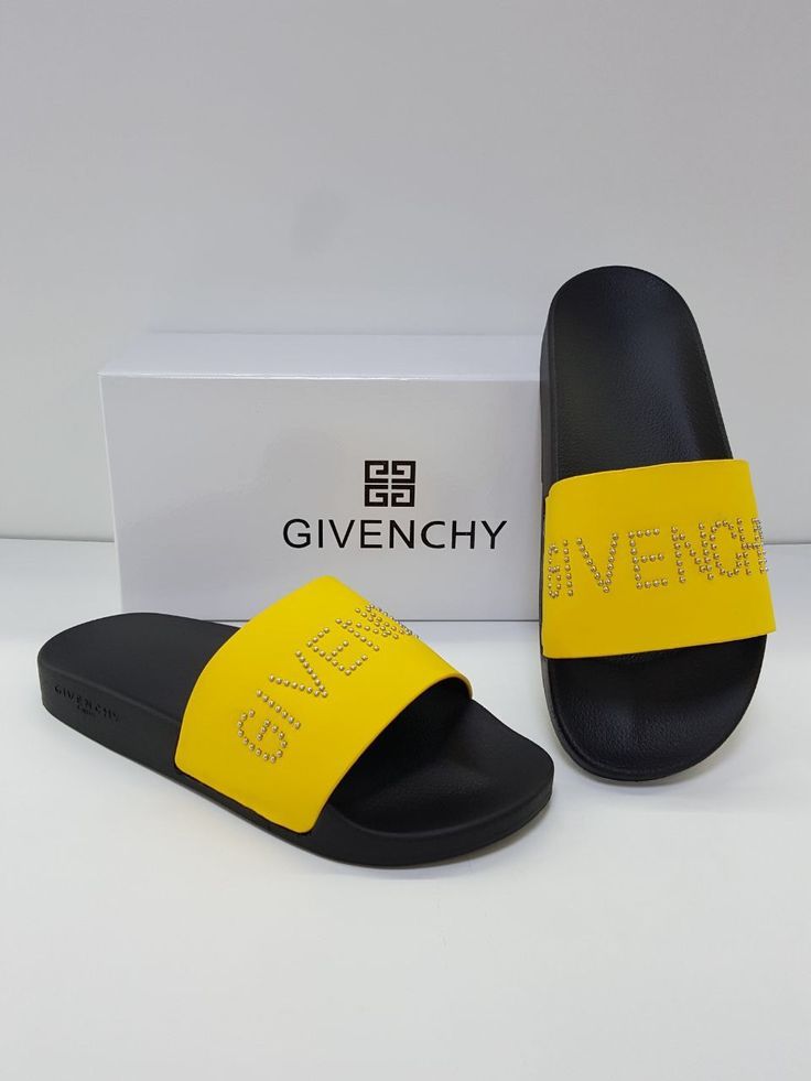 Black comfort slide sandals with a bright yellow strap featuring rhinestone lettering.